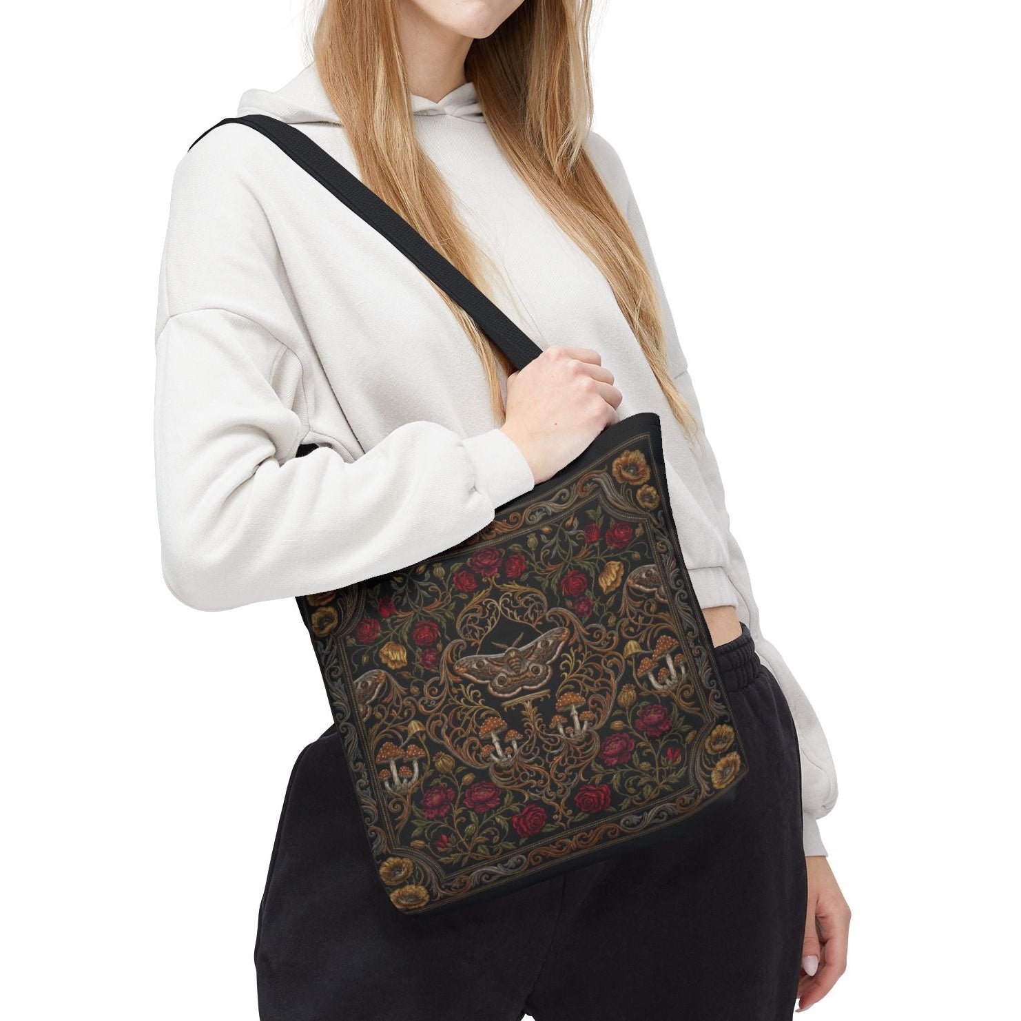 Woman holding a patterned bag on a white background