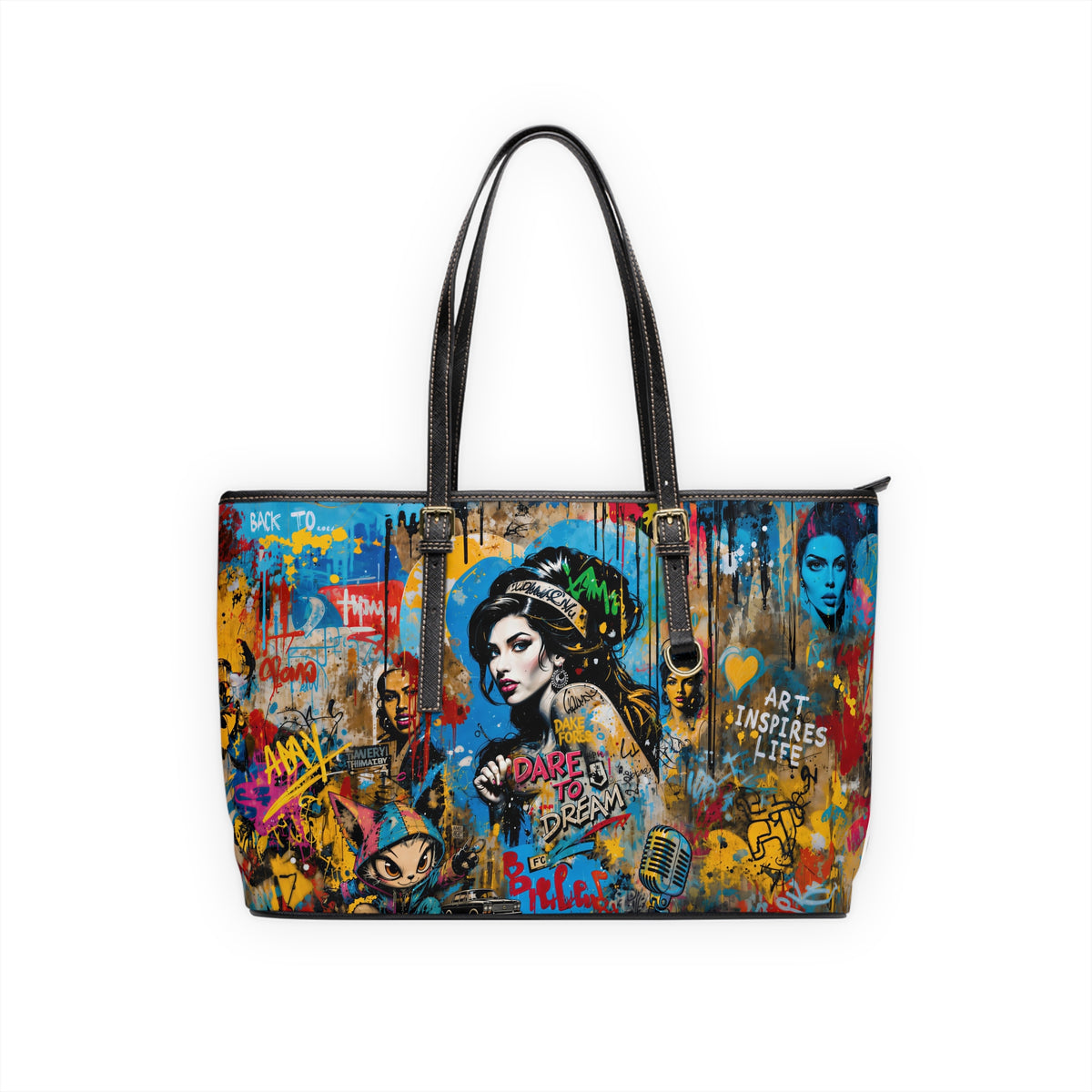 A structured tote bag featuring a vibrant, multicolor graffiti-style art print with portraits of Lady Gaga and text, finished with black leather handles and trim, shown against a plain white background.