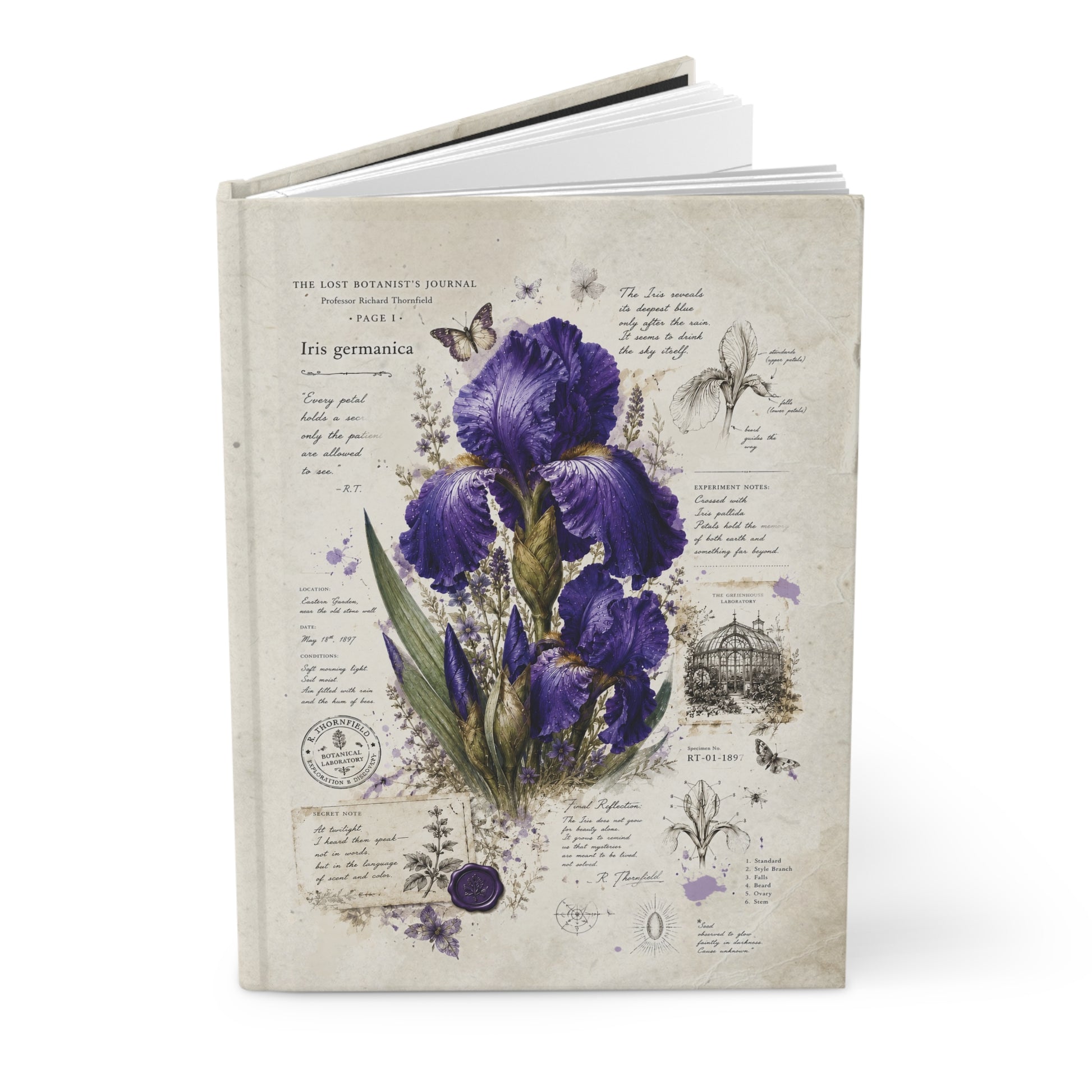 A hardcover journal featuring a vintage-style botanical illustration of purple irises on a cream-colored cover, shown standing upright against a white background.