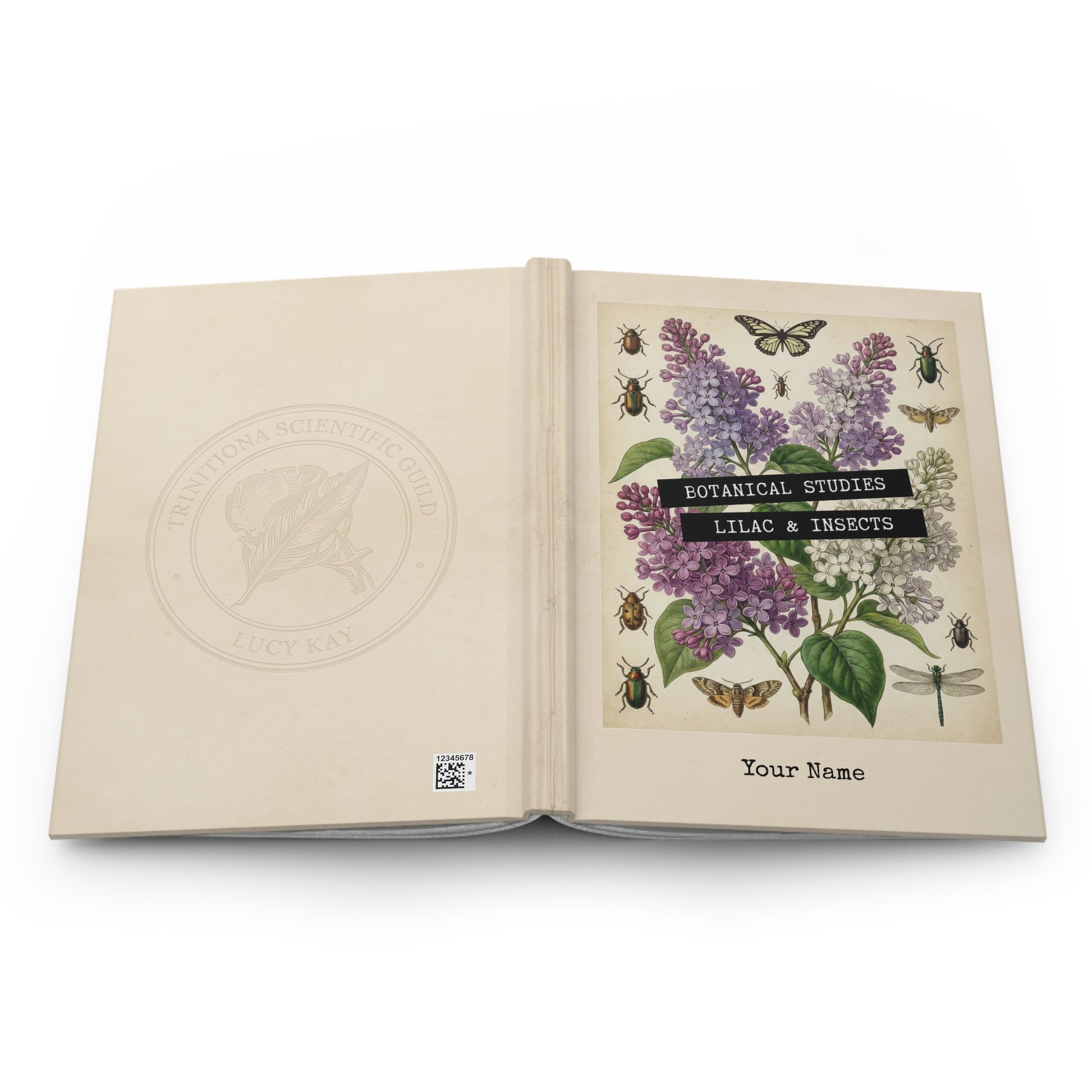 Open book with botanical illustrations of lilacs and insects on a white background