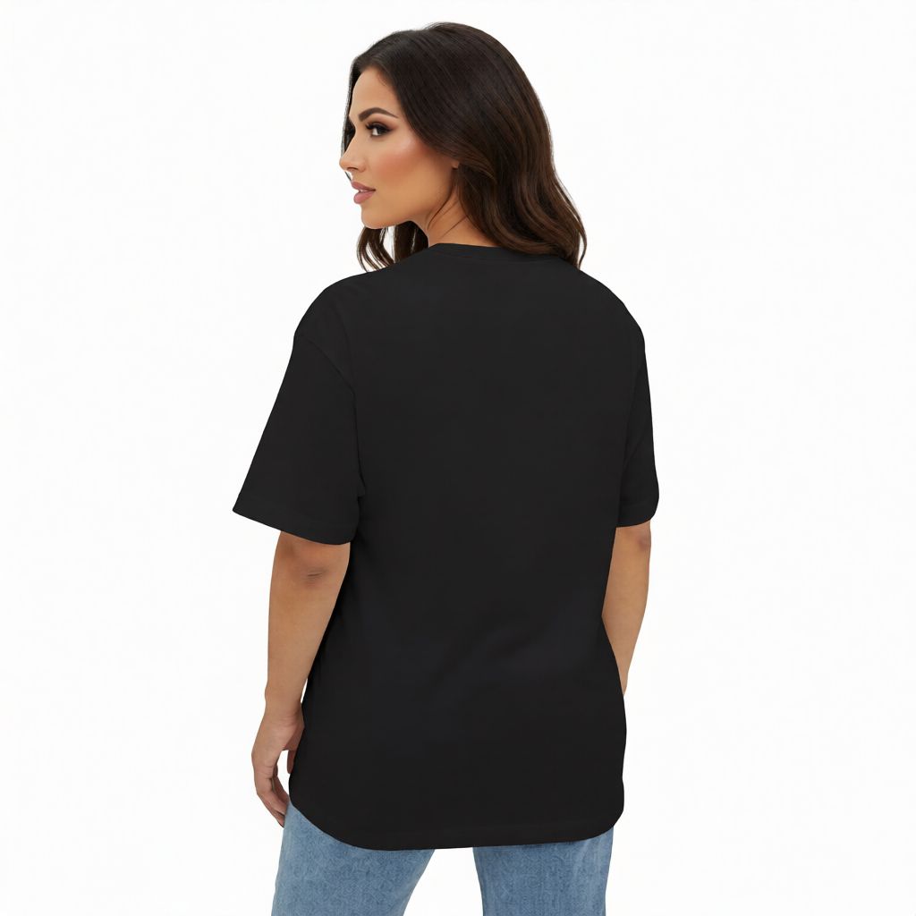 Woman wearing a black t-shirt and blue jeans on a white background