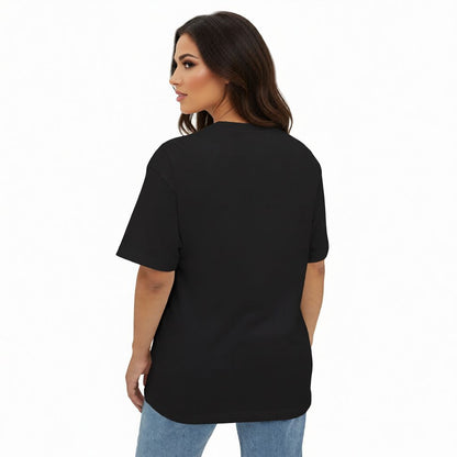 Woman wearing a black t-shirt and blue jeans on a white background