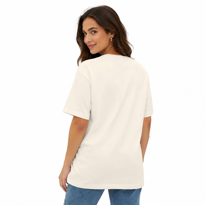 A woman wearing an oversized off-white short-sleeve t-shirt, shown from the back against a plain white background.